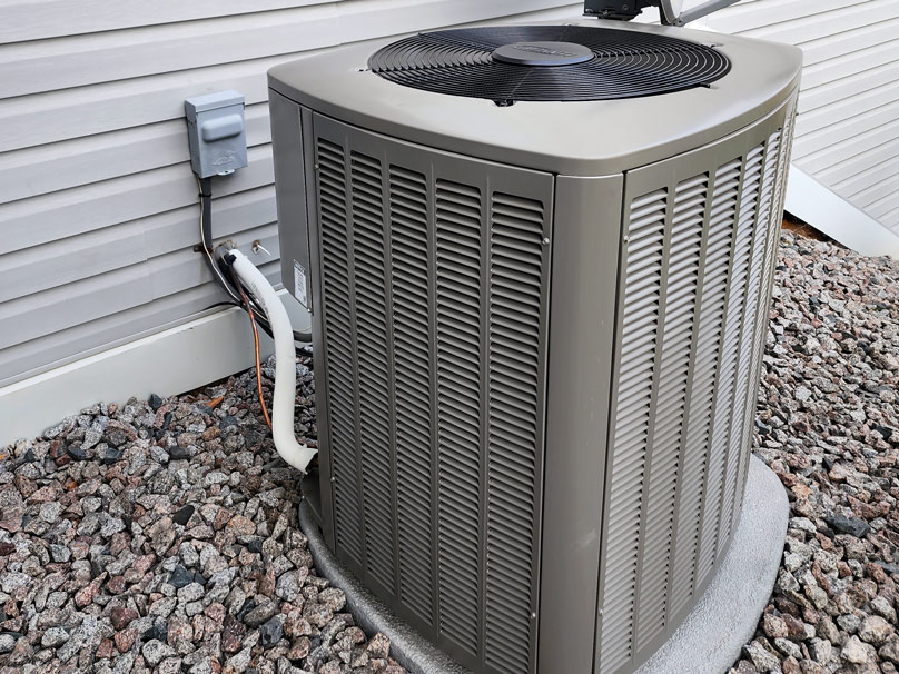 Air conditioner next to a home